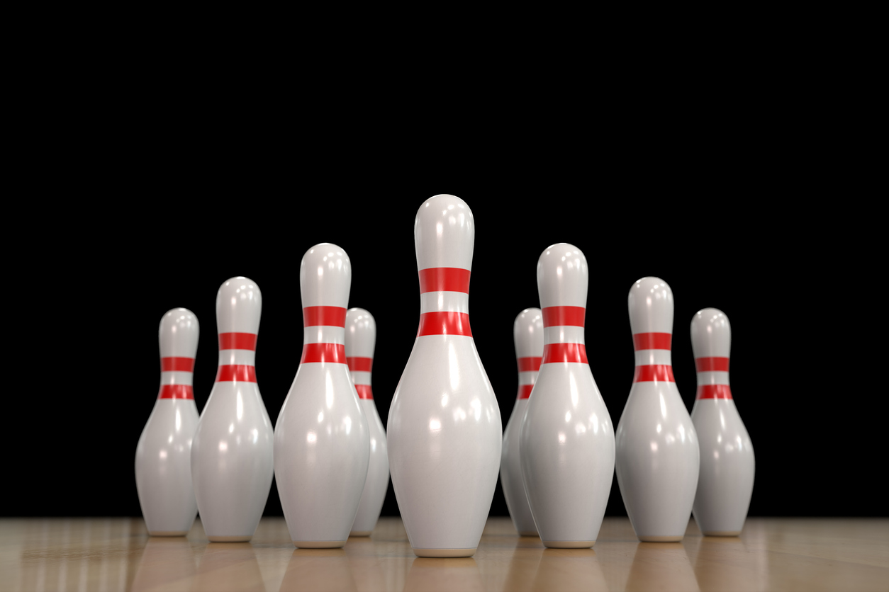 Close up 3D rendering of 10 bowling pins viewed from center of lane